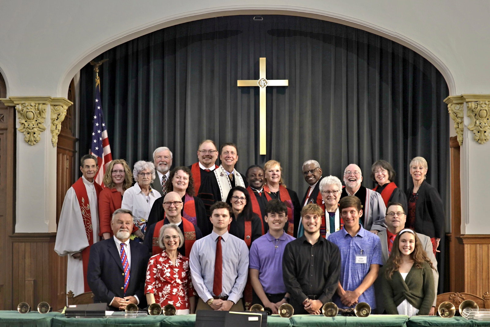 Two church members sharing a warm embrace in the sanctuary