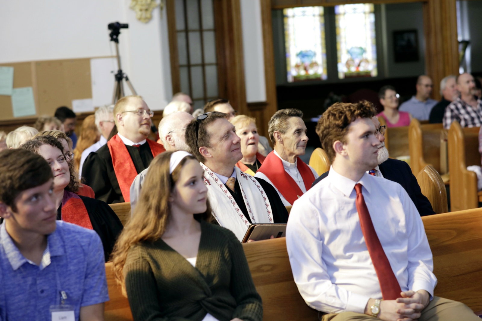 Pastor leading worship from the front of the sanctuary